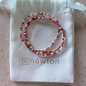 Mint condition enewton game day stack. Red, white, and gold 2mm beads $40